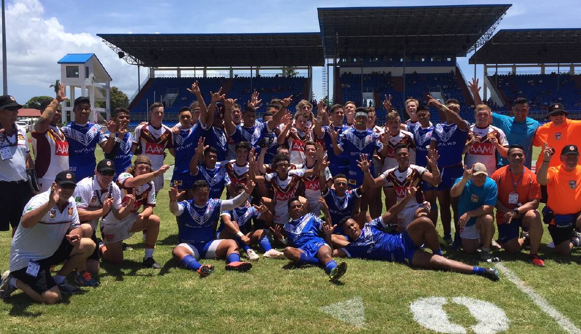 CHEERS: The NSW Country under 16s and the Samoan under 16s sides join forces for a photo at the end of their tour clash on Saturday at Apia Park, Samoa. Photo: CRL