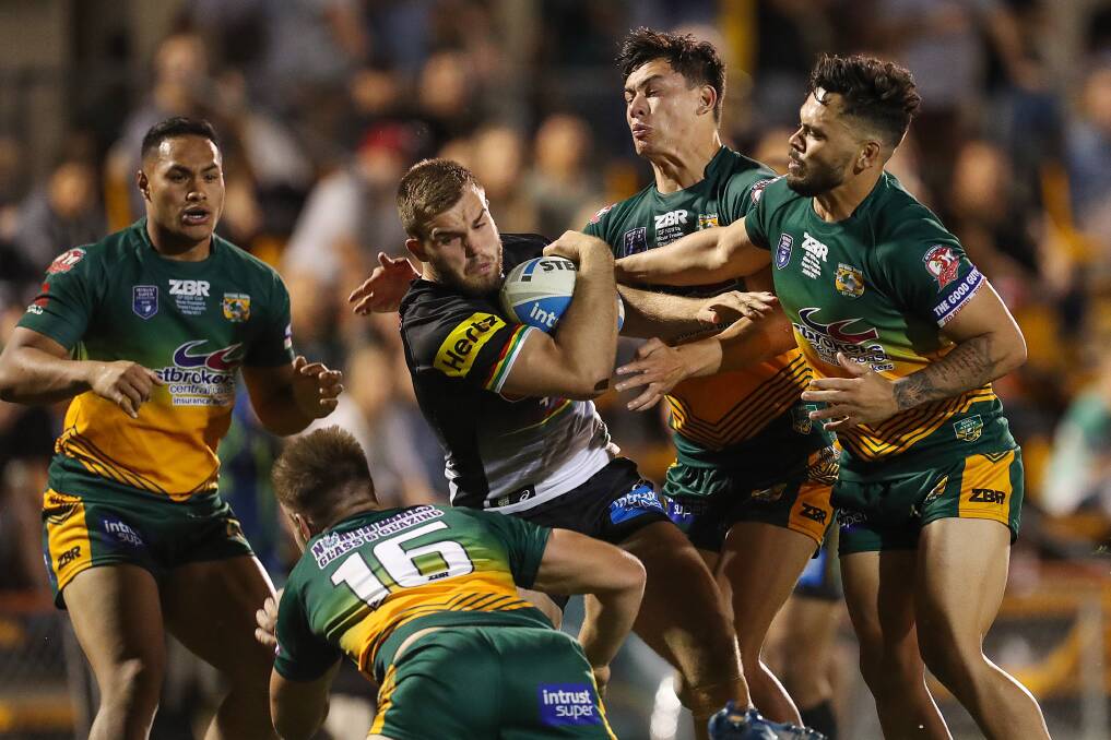 POWER: Wyong defenders, including Justin Toomey-White (right). Photo: NRL PHOTOS