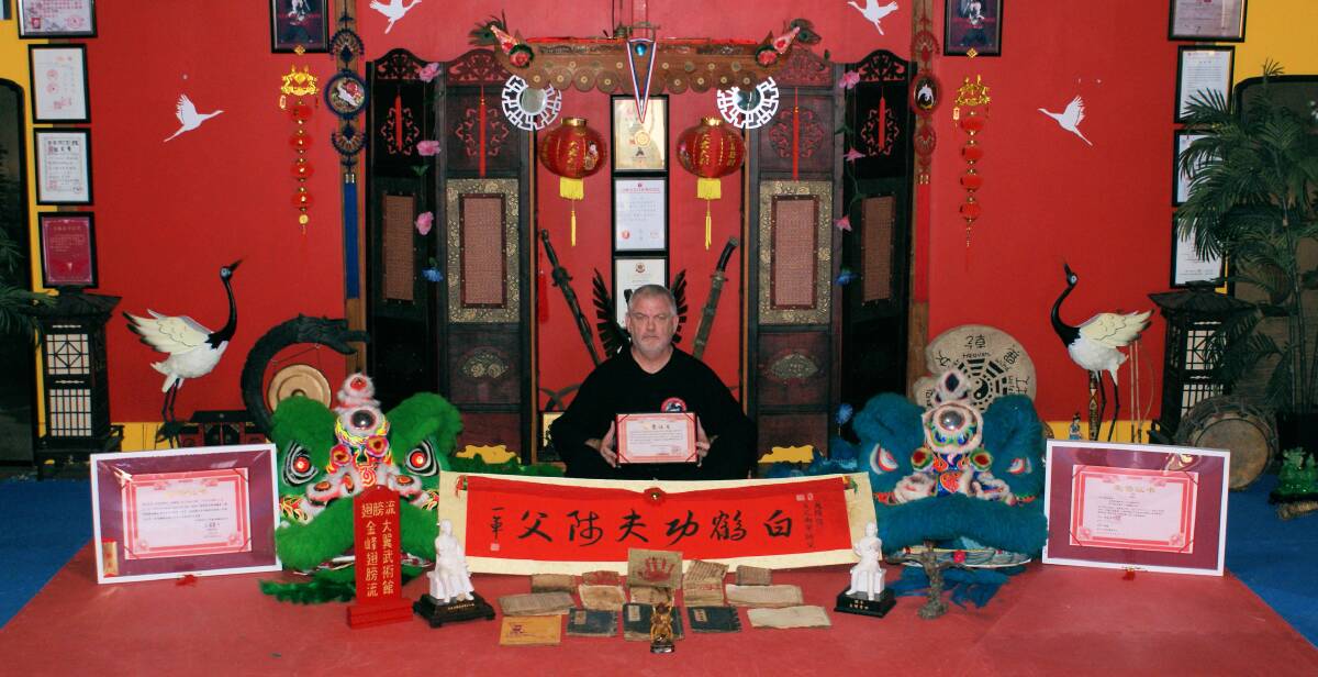 RECOGNITION:Local martial arts instructor, Ron Goninan, pictured with his awards and Ancient Martial Arts Texts. Photo: CONTRIBUTED