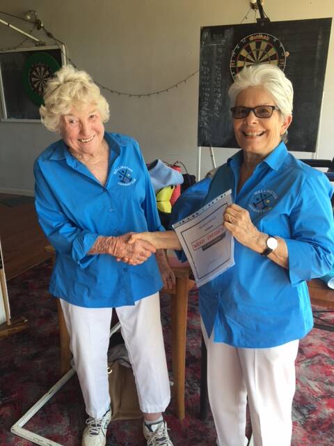 CROQUET: Winner Wendy Sheridan being presented with a certificate of congratulations from club president Chel Gregory. 