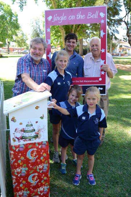 POSt BOX: Abby Kiss, Olivia Dimmick and Annika Taylor with Binjang's Tony Graham and Michael White, and Brad Rodgers of the Visitors Information Centre with the new post box. Photo: Elouise Hawkey