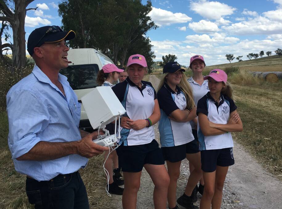 TECH AT ITS BEST: David Strahorn showing some students how his drone operates and collects cropping data. Photo: CONTRIBUTED
