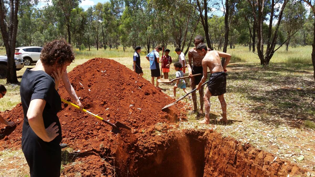 RESPECTFUL REBURIAL: Aboriginal youths helping to put the remains to rest. Photo: CONTRIBUTED.