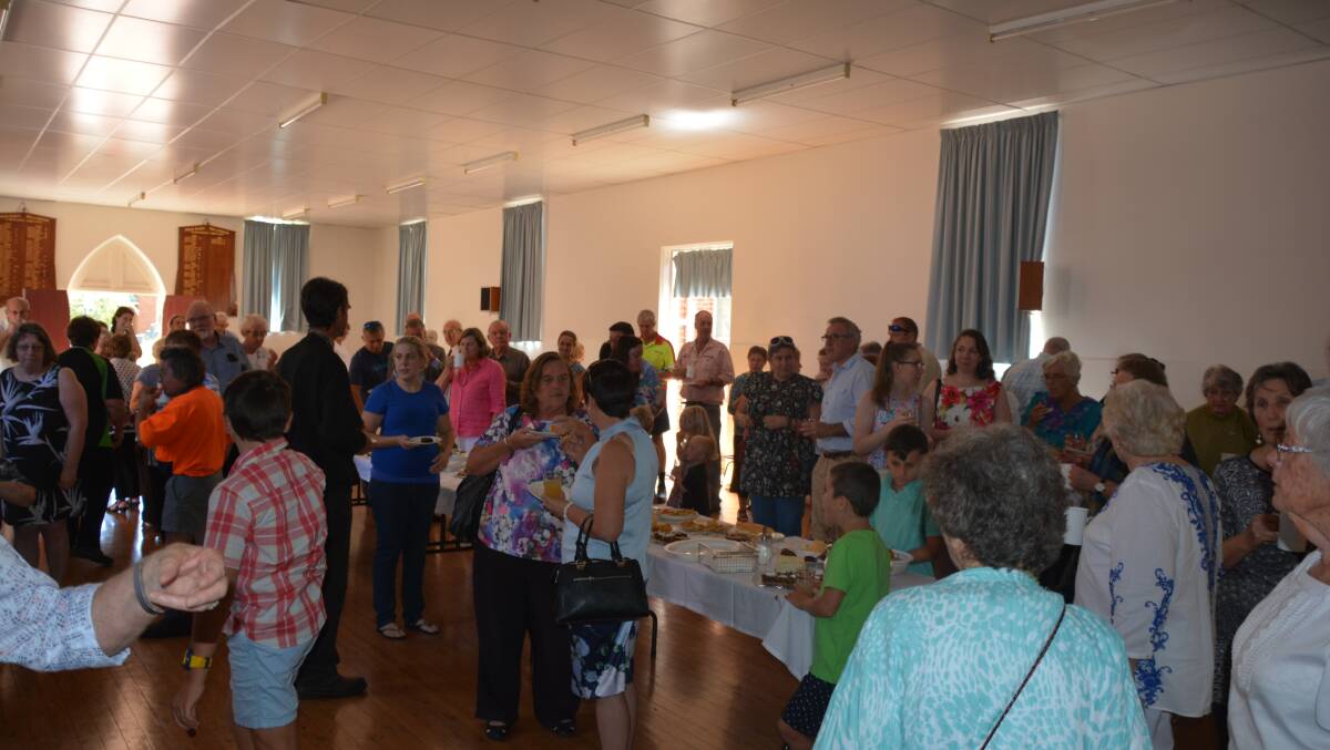 Everyone mingling while celebrating Reverend Leslie's time in Wellington.