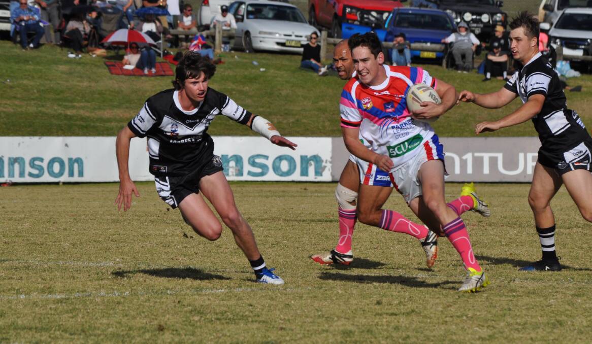 RIVALS: Parkes' Chad Porter in action against
Forbes at Pioneer Oval. Photo: NICK MCGRATH