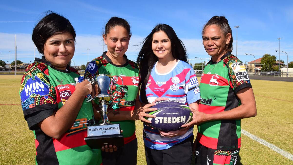 SPECIAL ROUND: Westside players Mia Anderson, Tarlee Roberts and Brigette Fernando with Macquarie's Jasmine Daley and the trophy on offer this weekend. Photo: BELINDA SOOLE