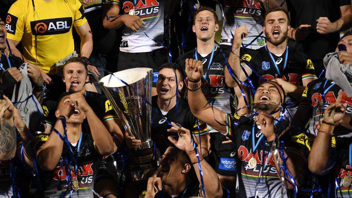 GLORY: Penrith Panthers players, including Dubbo's Kaide Ellis (top right), celebrate Sunday evening's ISP title win. Photo: NRL PHOTOS