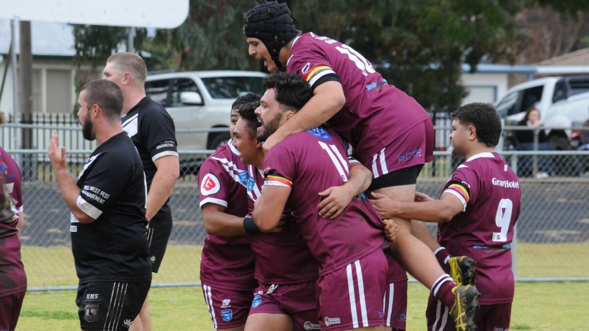 Wellington players celebrate a try during Sunday's win over the Forbes Magpies. Picture by Nick Guthrie