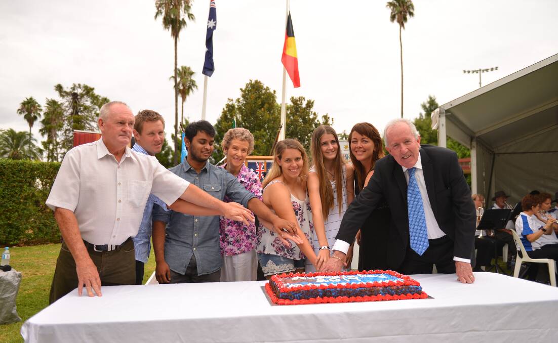 Dubbo Regional Council Administrator Michael Kneipp and Australia Day Ambassador Amanda Reid cut the Australia Day cake with Australia Day award recipients.