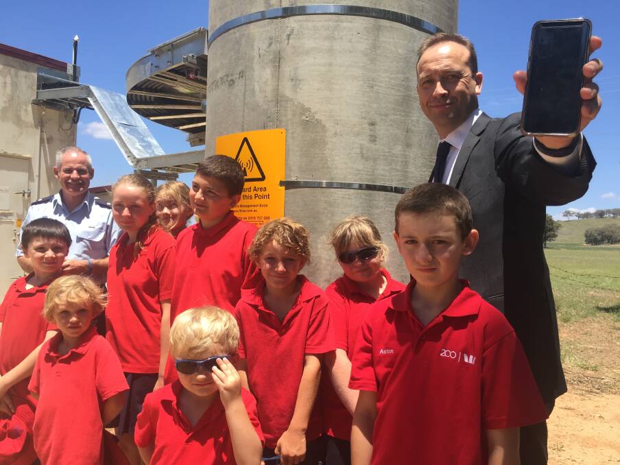 SWITCHED ON: Telstra area general manager Mike Marom and Goolma Public School students welcomed the Goolma Telstra tower on Tuesday. Photo: Honor Elliott