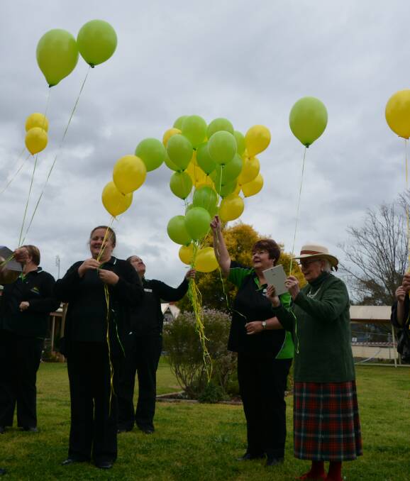 Remembering: Maranatha House emotional/spiritual support person Marian Pool (second right) leads the releases of balloons at the remembering ceremony. Photo: FAYE WHEELER