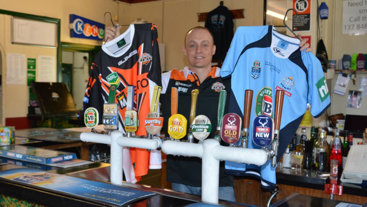 Show your true colours: Garry Handcock from the Federal Hotel displays jersey ahead of last year's Footy Colours Day. The pub will hold the fundraiser again on Sunday. File photo. 