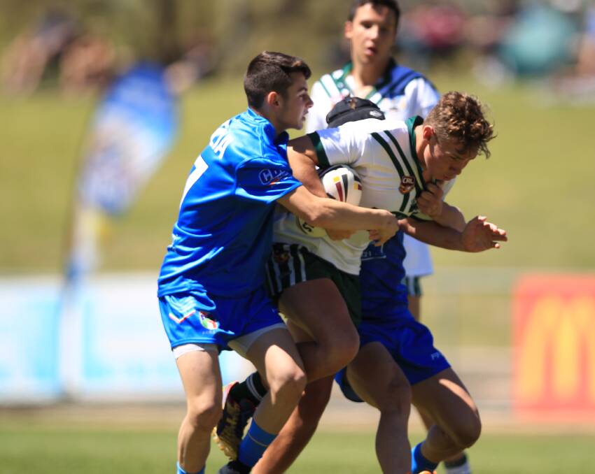 Grit: Western Rams under-16s centre Brock Naden from Wellington attempts to break through against the FIRLA defence on Saturday in Bathurst. Photo: Phil Blatch
