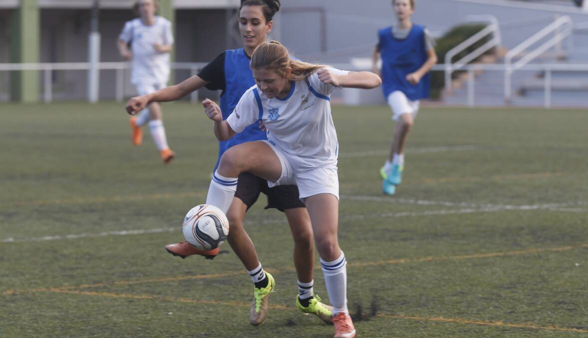 Spain game: Wellington High School Social Sports School team member Jacqui Ryan shows her skills on the field in a match against Luis of Aragones Social Sports School on October 5. Photo contributed.