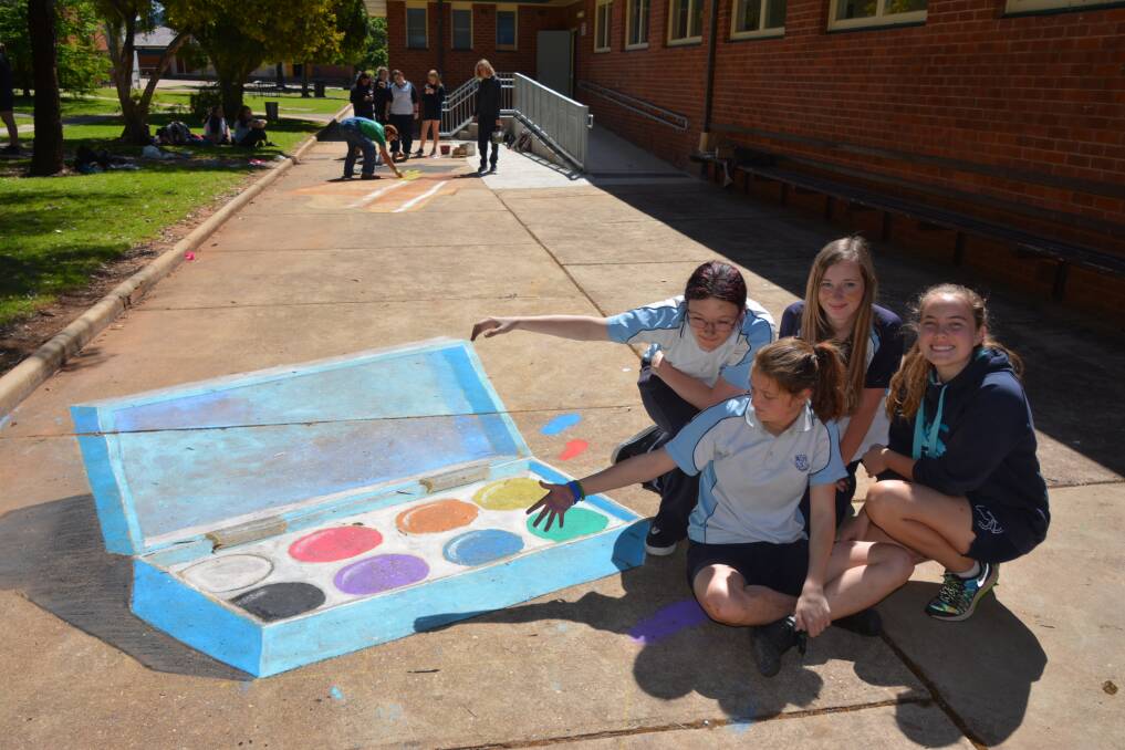 Wellington High School students Stevie Poulton-Fluke, Max-Ann Whittaker, Brianna-Lee McGovern and  Georgia Hammond have some fun with their 3D chalk art creation. Photo: FAYE WHEELER
