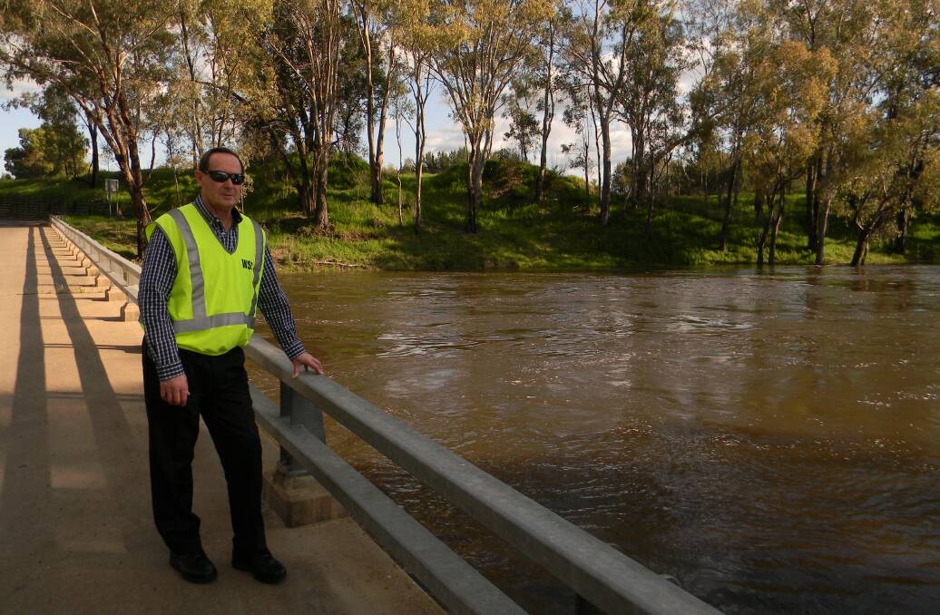 Closely monitored: Dubbo Regional Council local emergency officer Bryson Rees inspects the Macquarie River on Friday. Photo: FAYE WHEELER