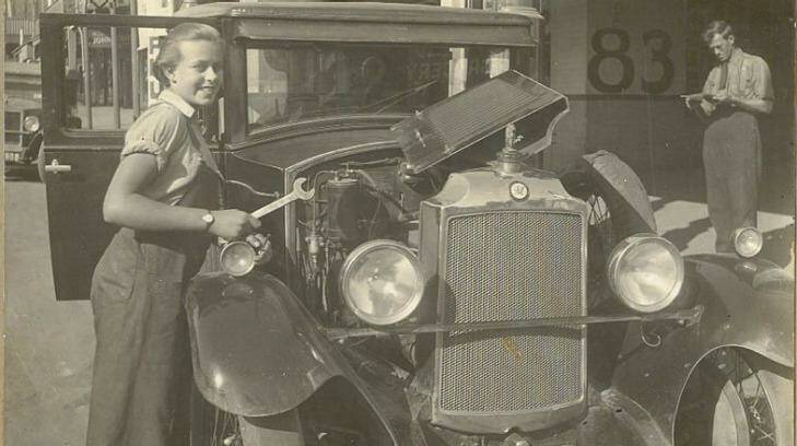 Sheila Agnes Grey (then Williamson) working as a mechanic at the Williamson's family garage on Cooma Street, Yass, aged 16.
 Photo: Supplied