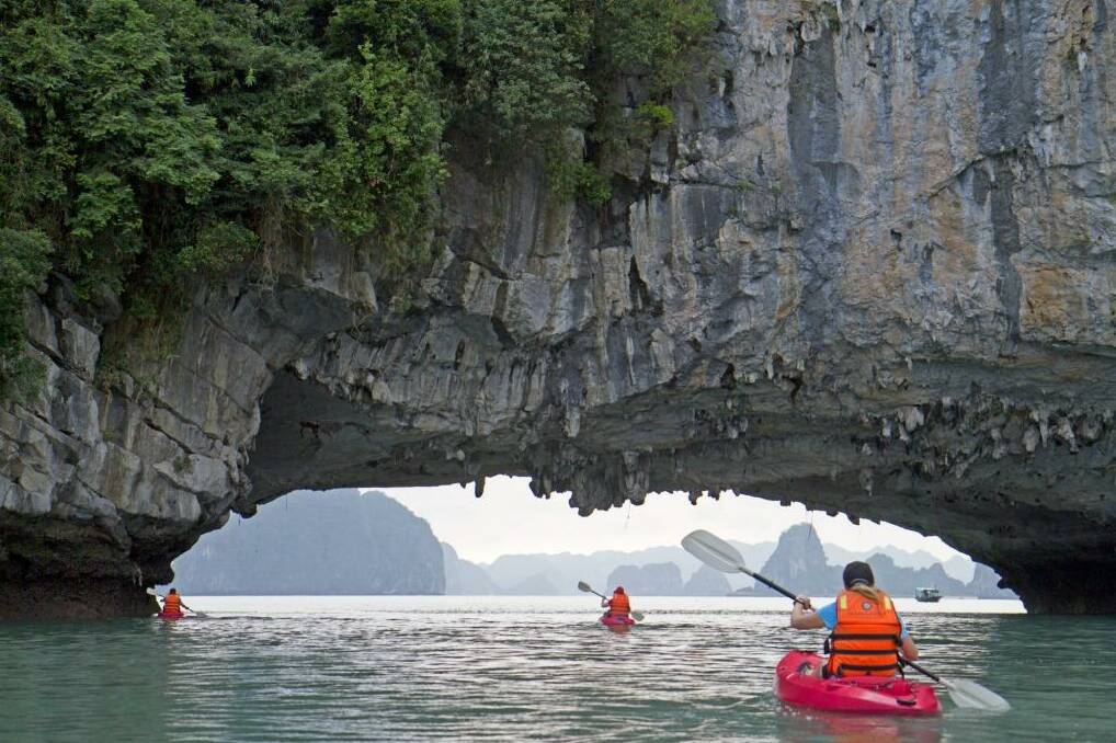 Under a sea arch in Halong Bay. Photo: Andrew Bain