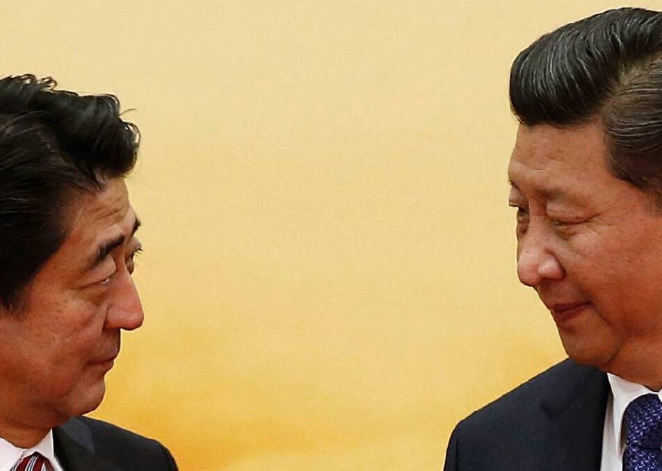 Not quite golfing buddies yet: Japan's Prime Minister Shinzo Abe and China's President Xi Jingping.