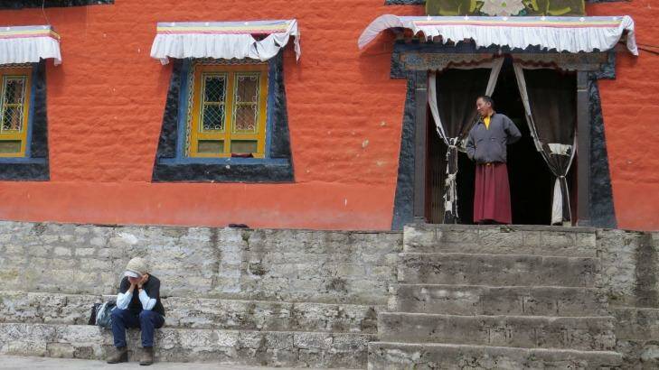 A monk looks at a trekker at Thame monastery. Photo: Katrina Lobley