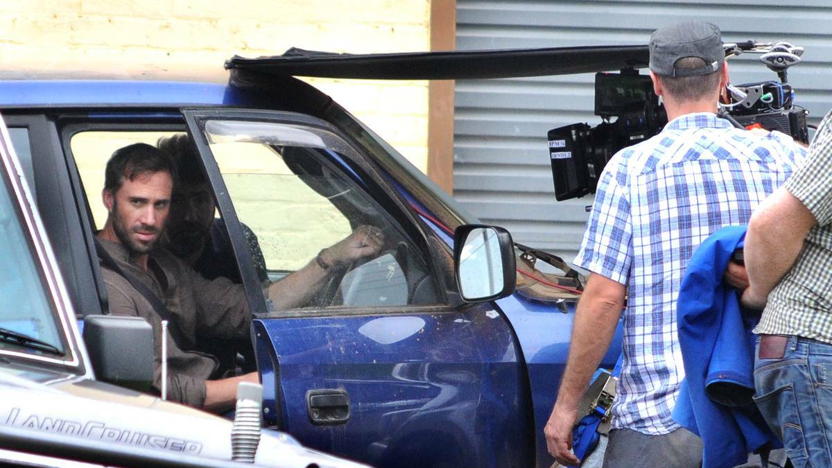 IN THE DRIVER'S SEAT: Joseph Fiennes on set at Canowindra. Photo STEVE GOSCH