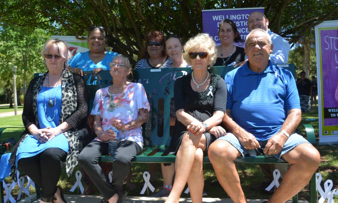 Families at the memorial bench on White Ribbon Day