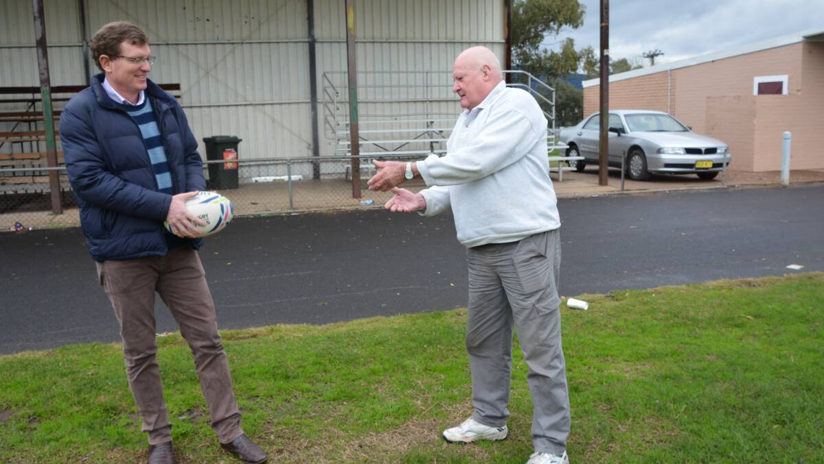 Ray Fabar (on the right) ready to take up the football and upgrade facility with the federal member for Calare Andrew Gee.