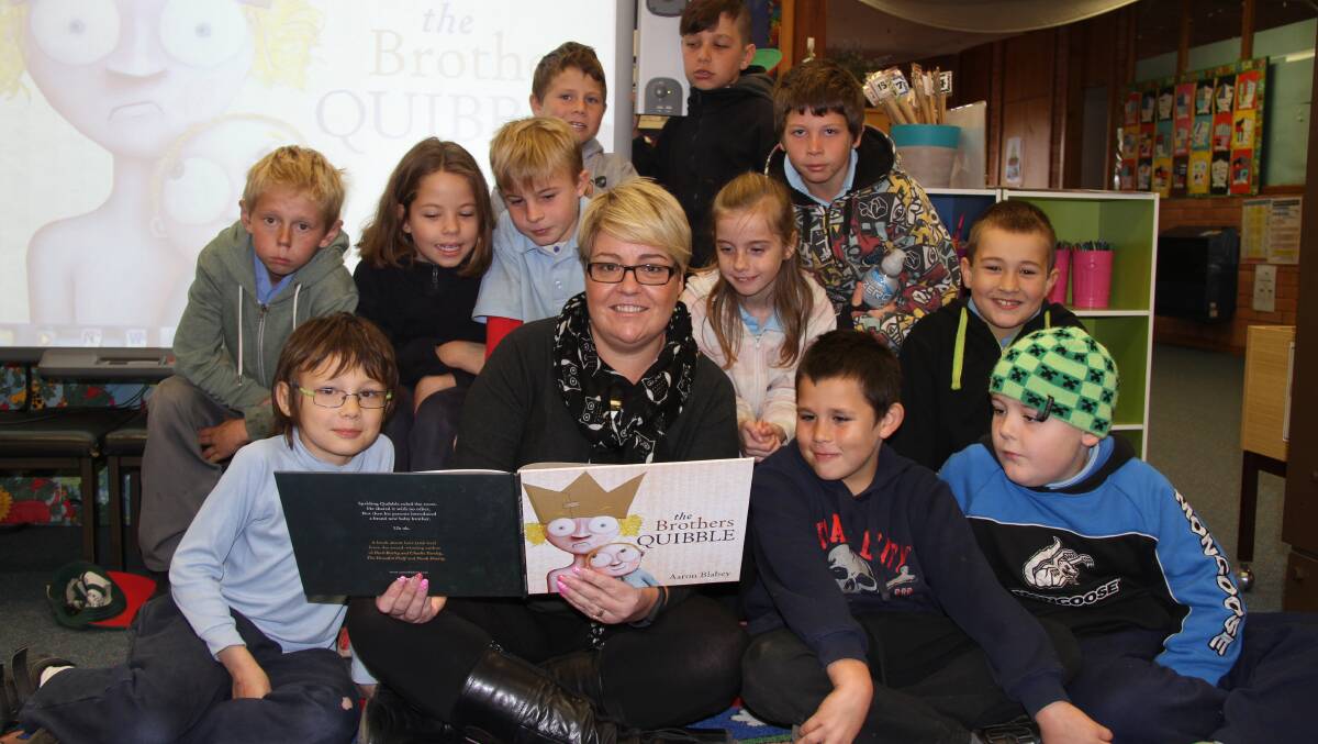 Librarian Kylie Fitsimmons and class 3T reading with the rest of Australia