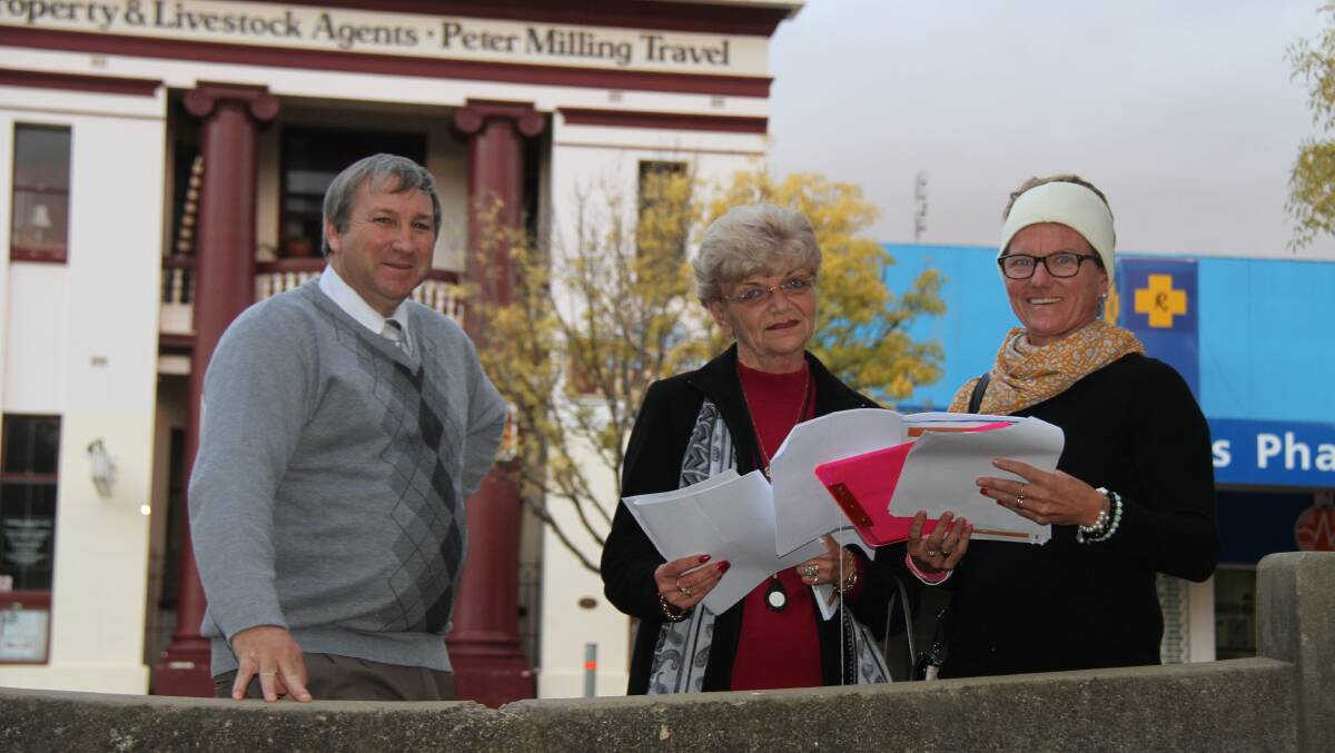 Stan Robb, Cr's Anne Jones and Pip Smith look at the CBD Beautification plans