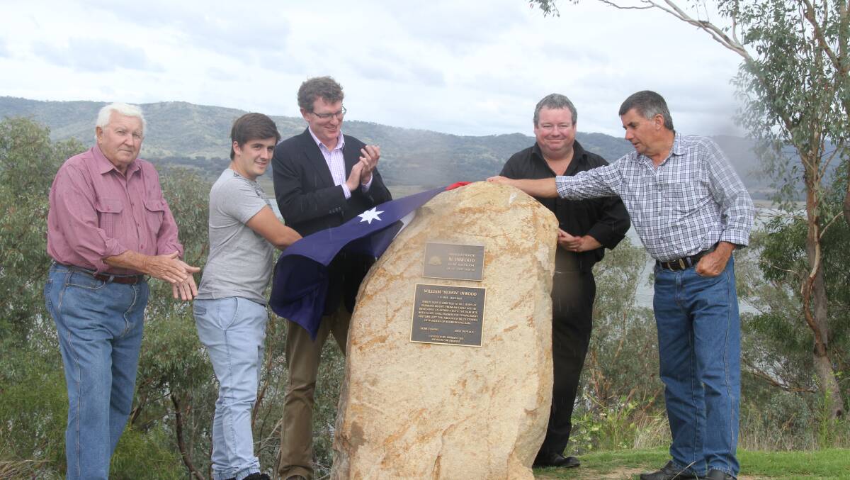Garry Braithwaite, Bill Inwood's grandson Josh Fiske, Andrew Gee, Jason Kirk and Bill Inwood's son Mark Inwood at the Lion Island lookout for the unveiling of the plaque. 