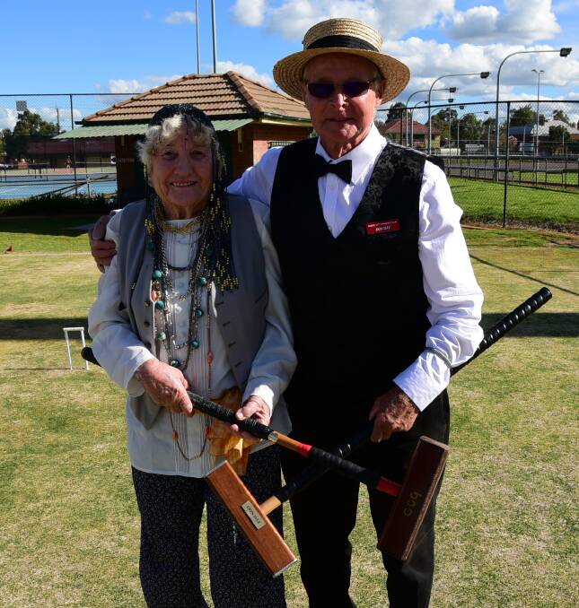 95 YEARS OF CROQUET: Chel Gregory and Don Day dressed in their 1920s best at the Dubbo Croquet Club's 95th celebration at the weekend. Photo: PAIGE WILLIAMS