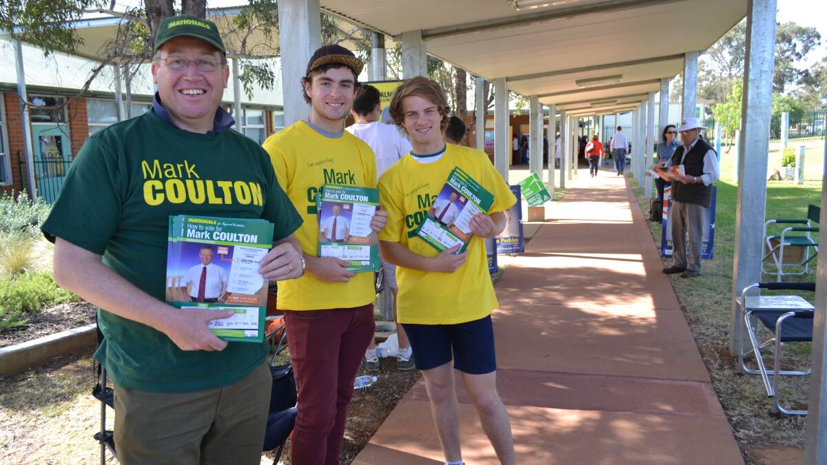 The Member for Dubbo Troy Grant assisted by Corey Suckling and Josh Archer at the Buninyong School booth on Saturday morning.