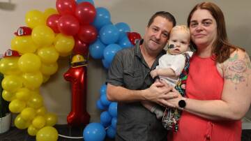 Birthday boy: Alan and Kelly Montgomery celebrated their son Ryder's first birthday with a little help from the community. Picture: Robert Peet