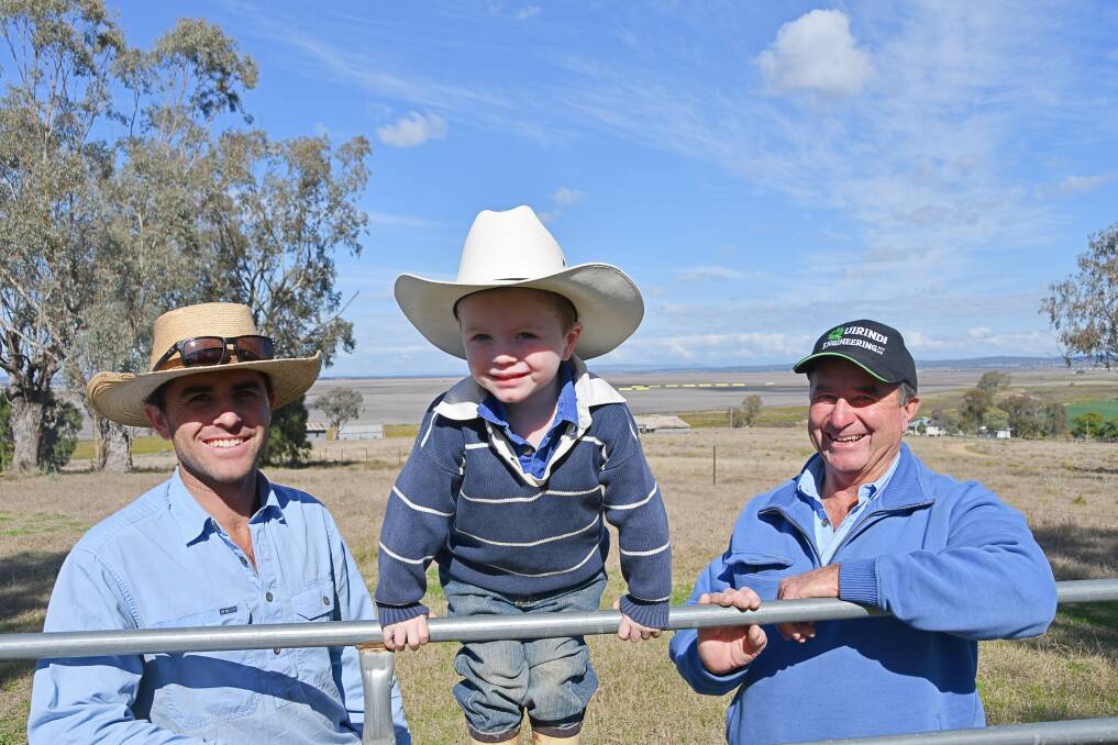 James, Archie, 3, and Andrew Pursehouse are part of the three generations working the family's farmland, which would have been surrounded by Shenhua's Watermark coal mine. Photo: Billy Jupp 