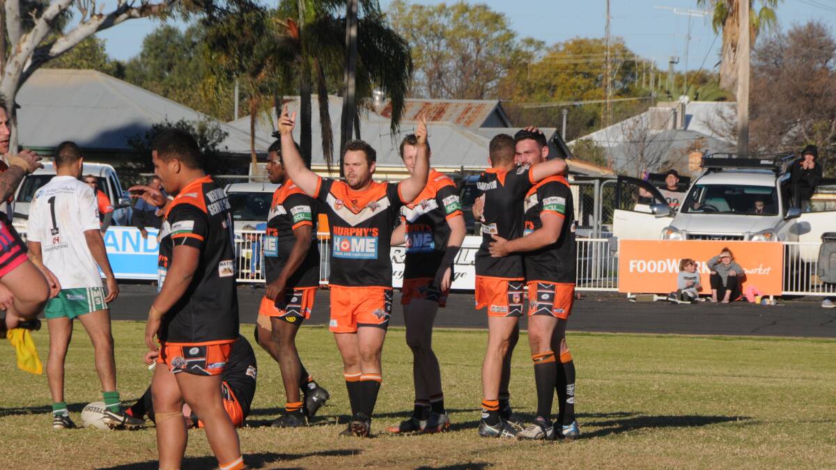 VICTORY: Jacob Neill salutes the Larkin Oval faithful after his side defeated CYMS 14-0 on Sunday. Photo: NICK GUTHRIE