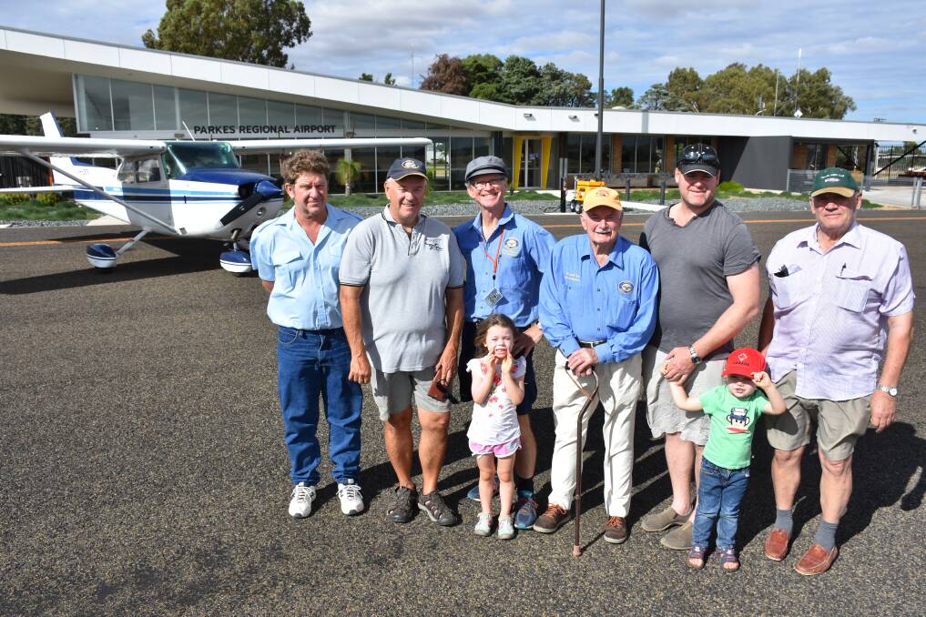Parkes Aero Club is turning 70. Pictured are members Darren Mann, Erik Lensson, Brett Preisig, Maggie McConnell, Warwick Tom, Wade and John McConnell, and Bill Barber.