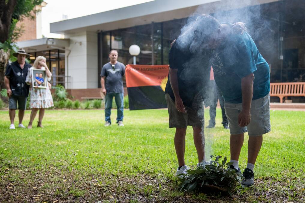 Brandon Rich's family outside Dubbo Court House in 2023 performing a smoking ceremony. Picture by Belinda Soole 