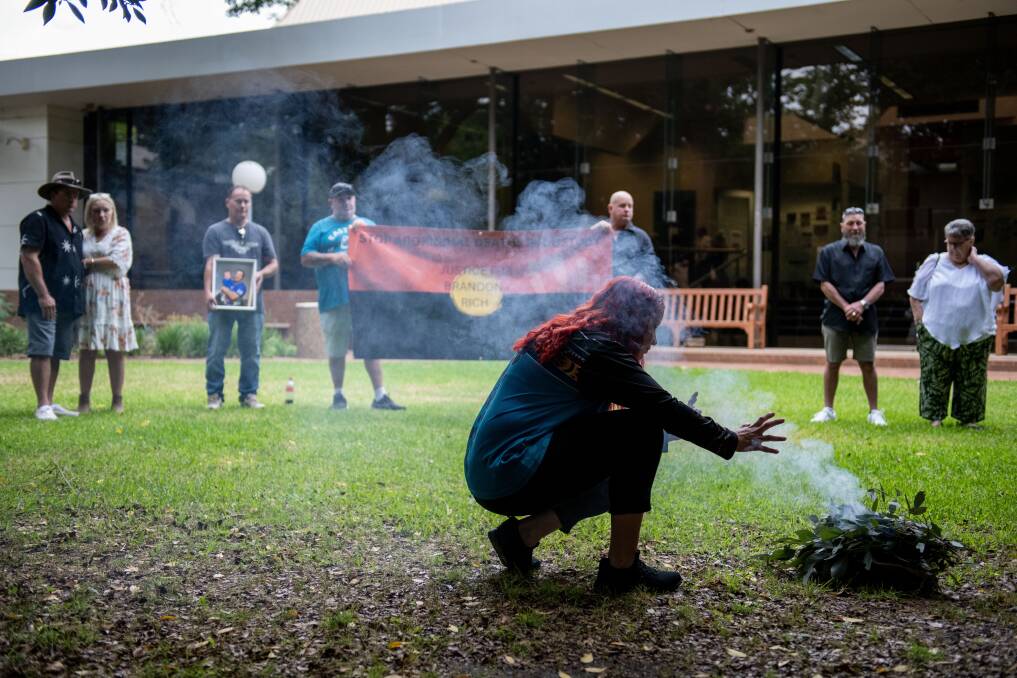 Brandon Rich's family watches on as an Indigenous Legal worker takes part in the smoking ceremony. Picture by Belinda Soole 