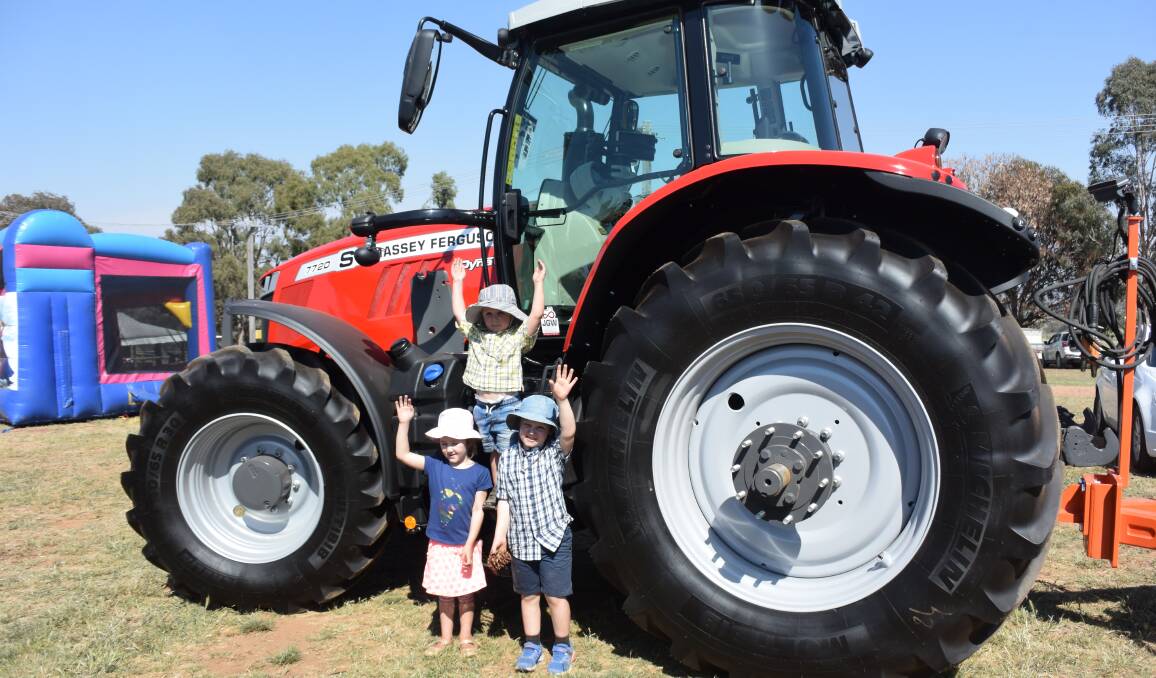 BIG WHEELS: Kaylee, Callum and Declan Macrae loved the big tractors on display at the Field Days. Photo: DAVID FITZSIMONS