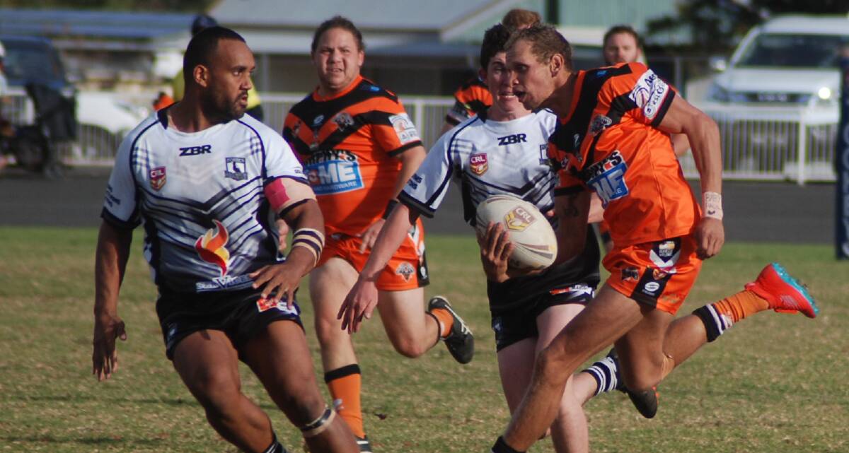 IN A FLASH: Tigers winger Ash Widders finds space against Forbes. Photo: ZAARKACHA MARLAN
