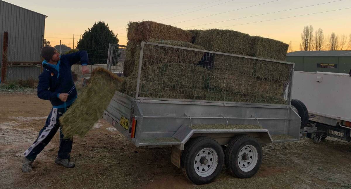 Mitch Kennewell from Feed4Farmers and Tommy from Hay Run Tommy's Truck donated hay to farmers on Saturday. Photos: TOMMY