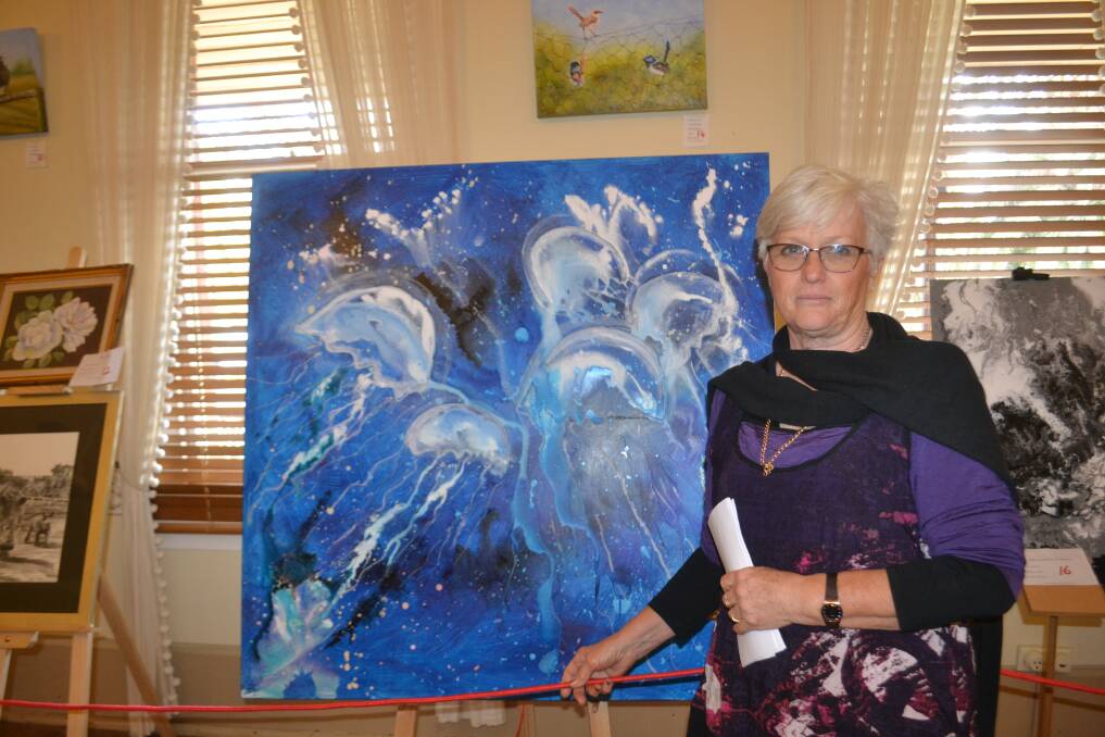 FAR LEFT: 'Artist Jan Payne with her artwork at last year's Arts and Sculpture Festival'. Photo: CONTRIBUTED.