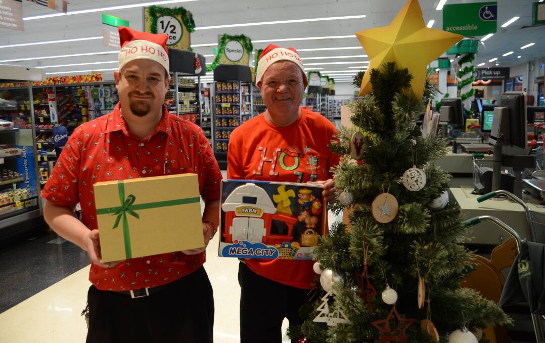 TOY DRIVE: Woolworths Wellington store manager, Graham McKenzie with staff member Graeme Dowton. Photo: Elouise Hawkey