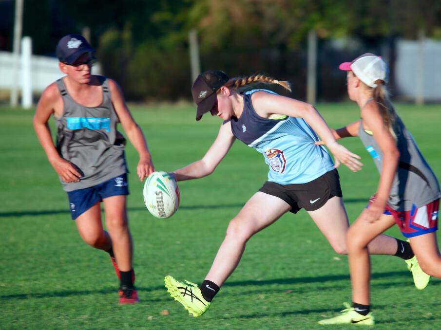 ON THE MOVE: Claudia Whiteman in action in a recent match of touch football. Photo: JO IVEY