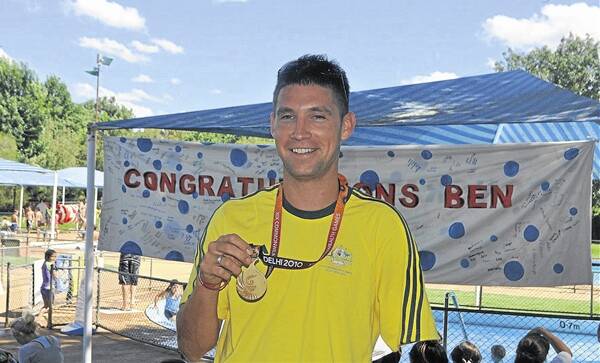 BATON: Ben Austin OAM will carry the Queen's Baton through Wellington on January 30. He is pictured with his Commonwealth Games gold medal in 2010.