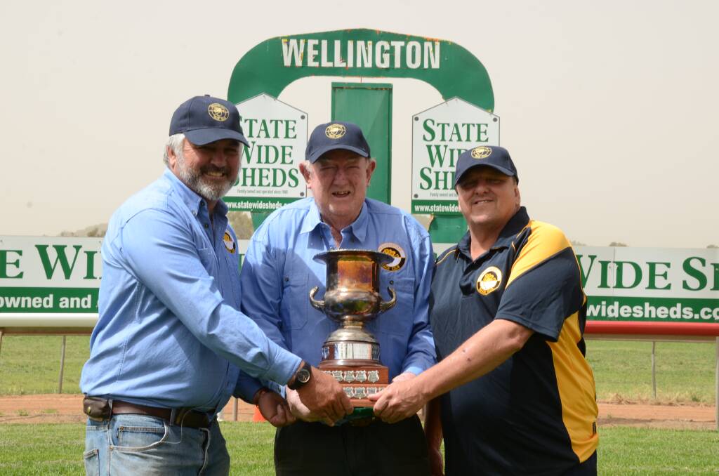 Wellington Race Club treasurer Peter Barton, with Ian Giffin and club president, Ian Darney with the Wellington Cup.
