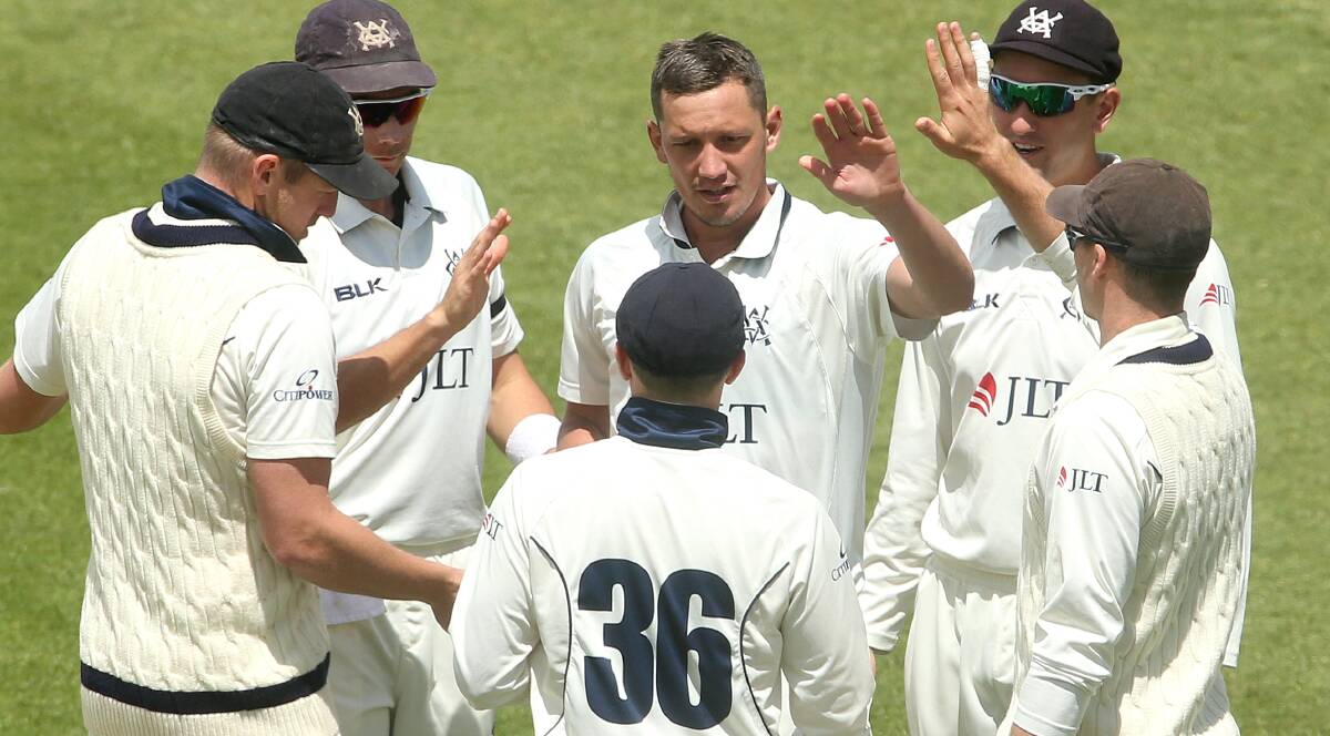 UNLUCKY: Chris Tremain (middle) celebrates a wicket with victory earlier in this summer's Sheffield Shield. Photo: AAP/HAMISH BLAIR