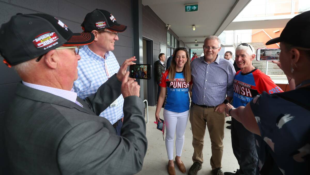 ALL SMILES: Prime Minister Scott Morrison smiles for photos during his visit to the Bathurst 1000 in October.