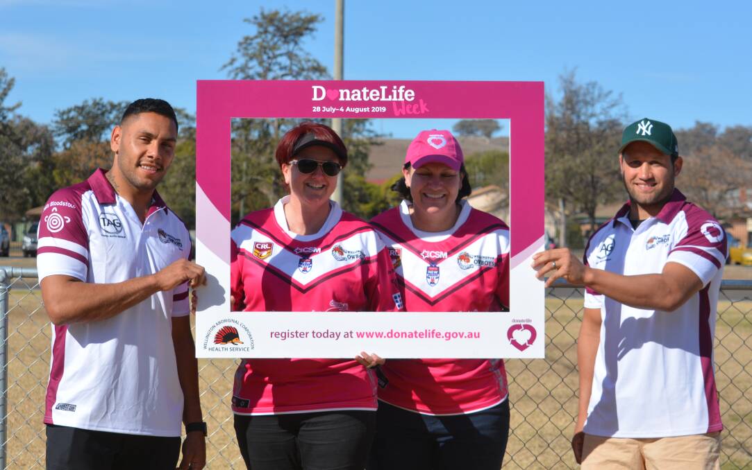 Register to help: NSW Organ and Tissue Donation members Leah Upcroft and Danielle Griffiths (middle) with NRL players Jesse Ramien and Tyrone Roberts. Photo: Taylor Jurd. 