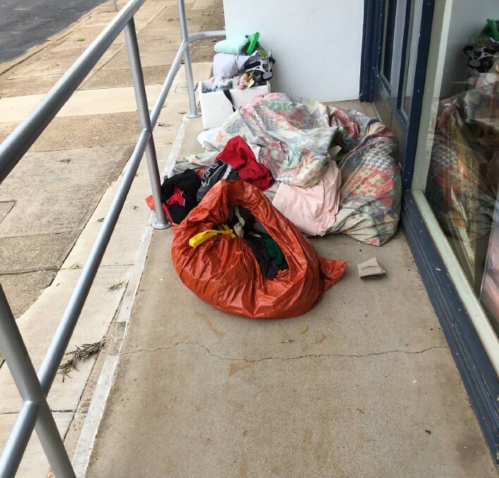 A load of rubbish: St Vincent de Paul store president Peter Duffy said people have gone through four of their red bins and thrown rubbish everywhere. Photo: Supplied. 